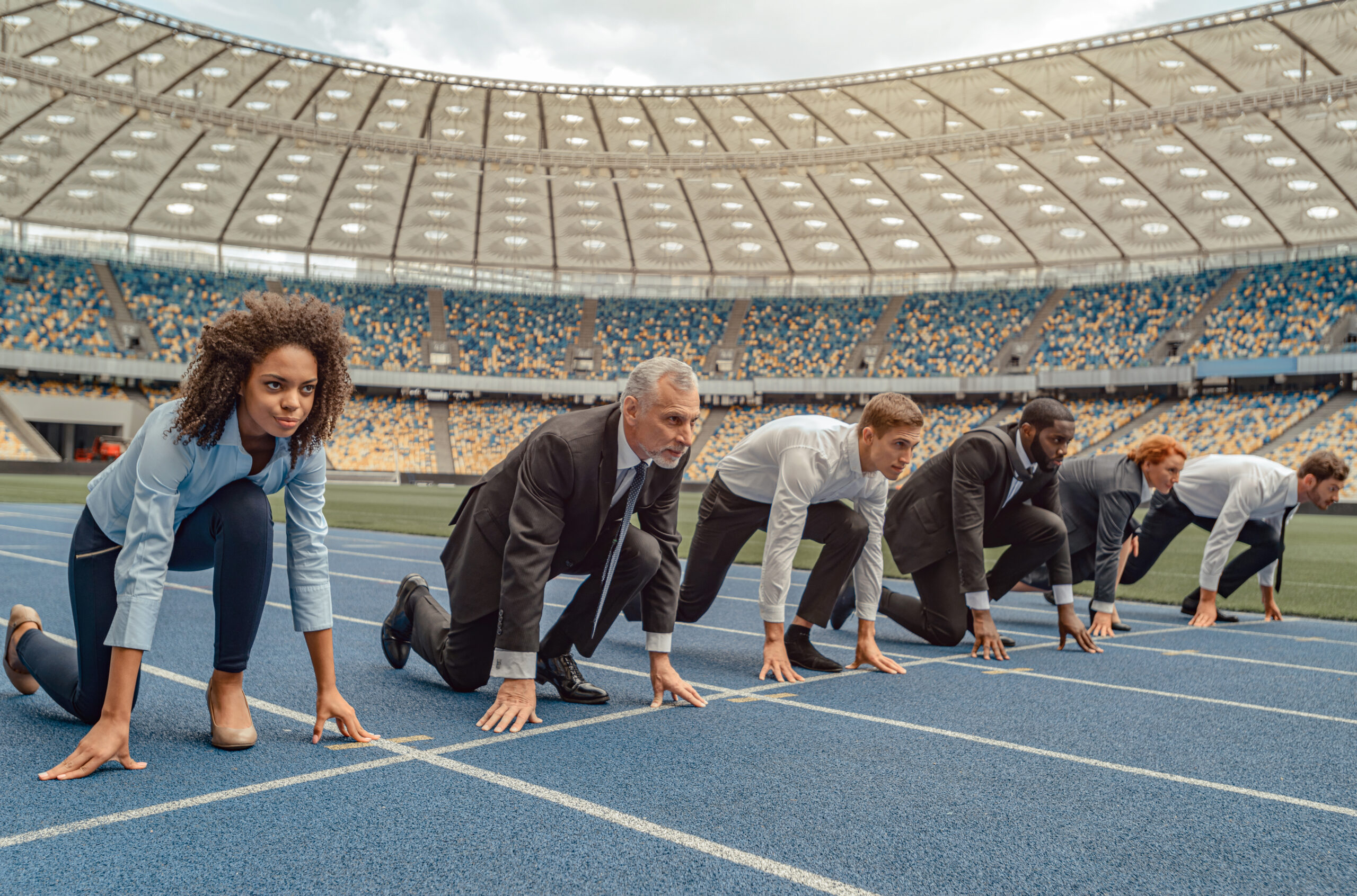 Business people standing ready for run sprint competition on race track Group of entrepreneurs standing at starting