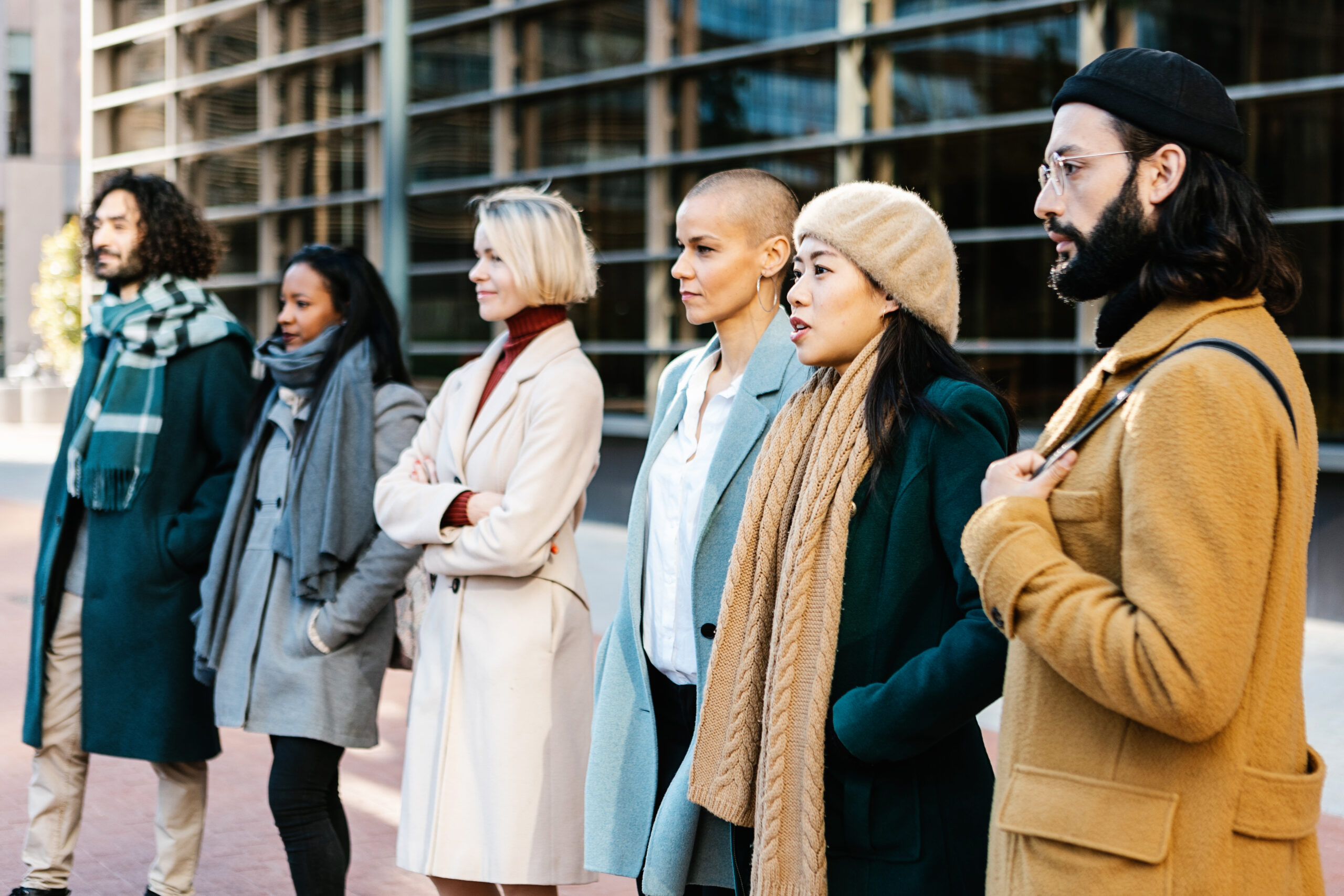 Large group of business people standing together at city street. Large group of business people standing together at city street. Teamwork and professional corporate colleagues concept.